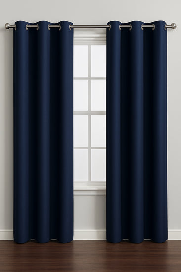 Navy blue curtains with grommets on a window with a white frame.